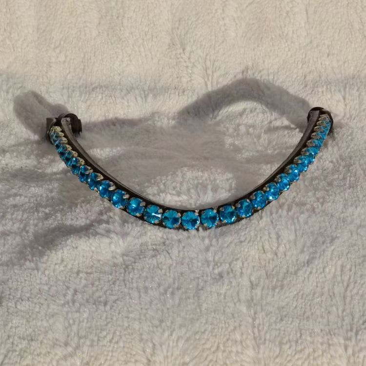 Blått pannband med stora stenar