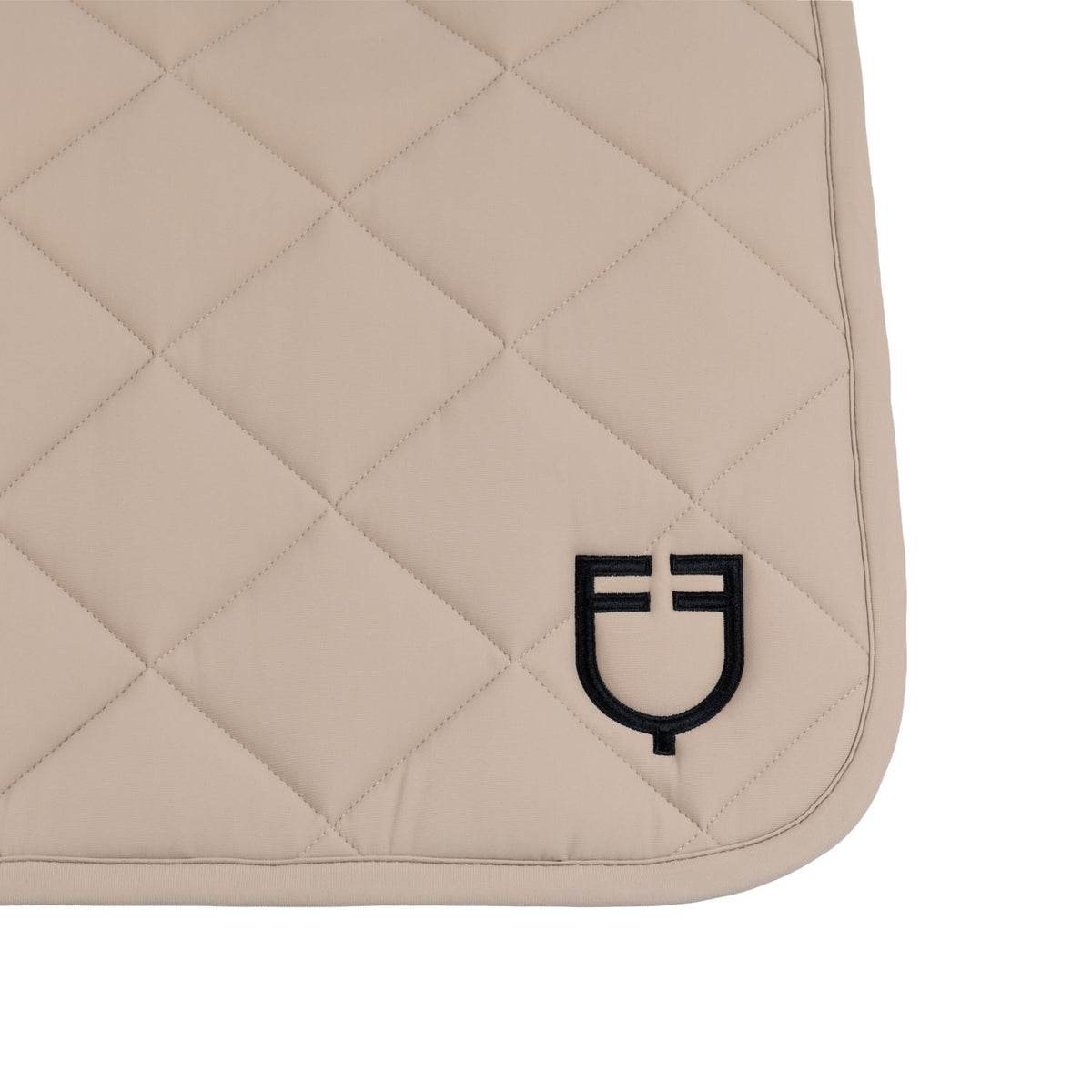 Dressage saddle pad with diamond quilting and embroidered logo