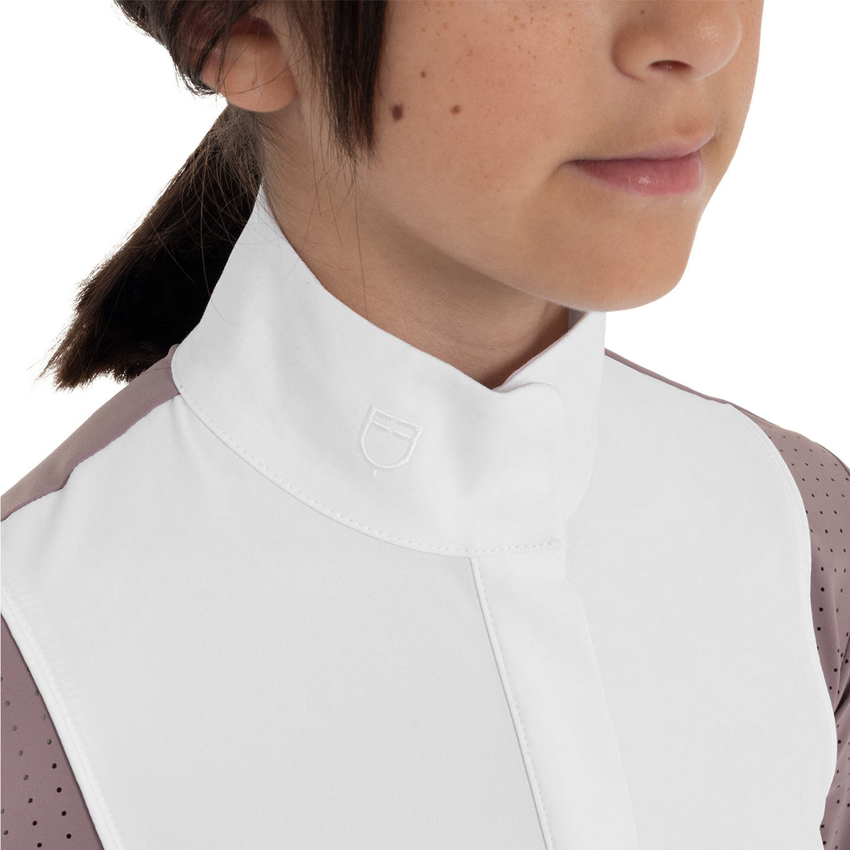 Girls' competition polo shirt with perforated inserts